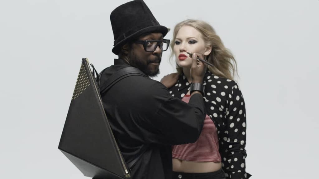 will.i.am applies makeup to Anja Nissen