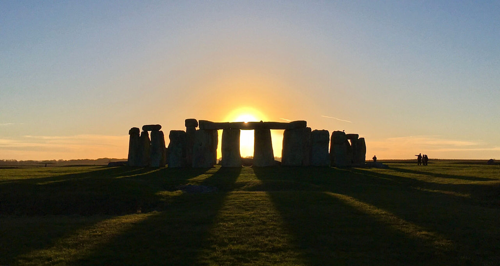 Summer Solstice sunrise at Stonehenge, sun rising between the stone pillars
