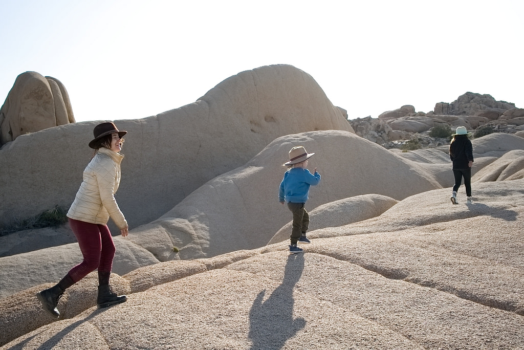 Hagar walking on boulders with her kids