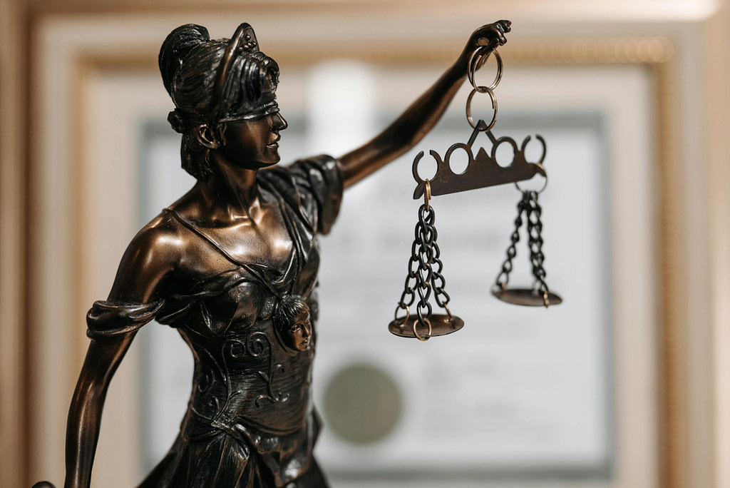 Statue of Lady Justice holding scales symbolizing balance and discernment for the Libra full moon